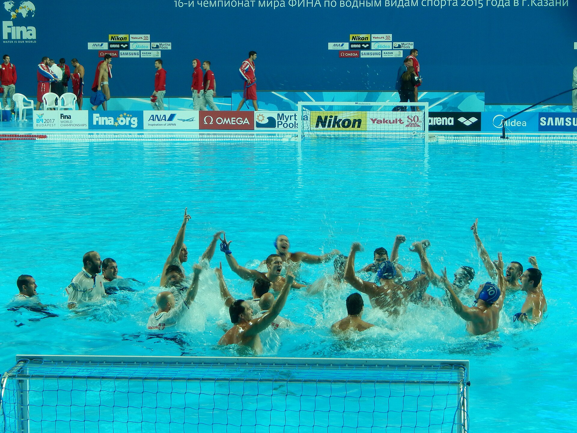 Water polo players contesting the ball during a match